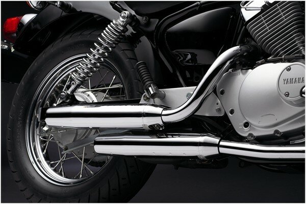 The chrome exhaust pipes of the Yamaha V-Star 250