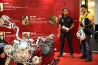 Some person interested in one of the [story:The-Indian-Motorcycle-Story Indian Motorcycles] at the Bangkok Motorbike Festival 2014