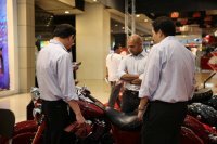 People inspecting on of the [story:The-Indian-Motorcycle-Story Indian Motorcycle] at the Bangkok Motorbike Festival 2014